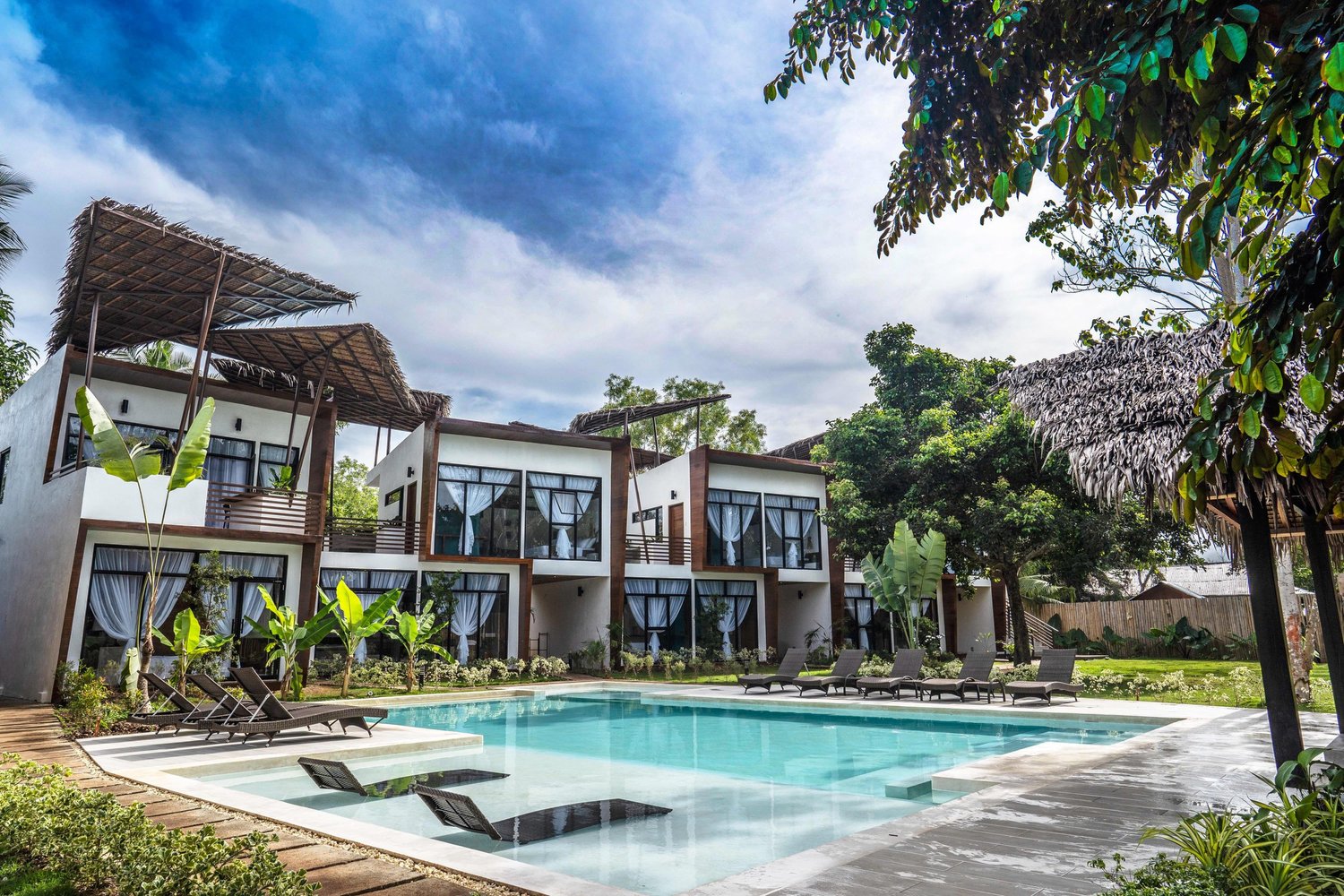 The swimming pool surrounded by tropical greenery at Bird of Paradise Bohol